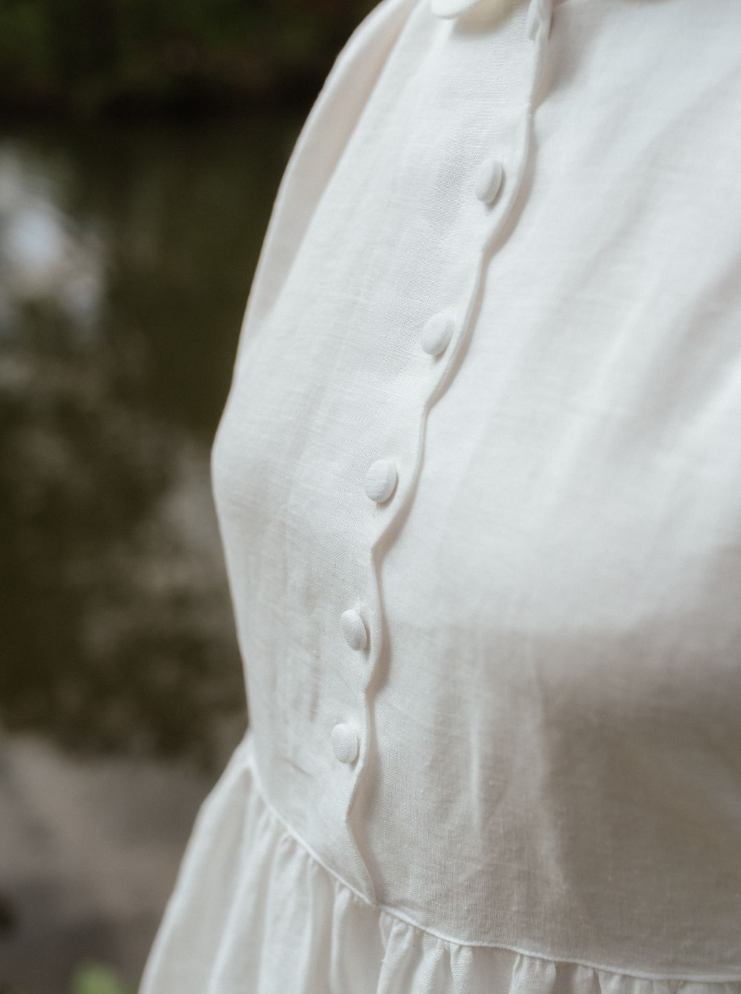 detail of scallops and covered buttons