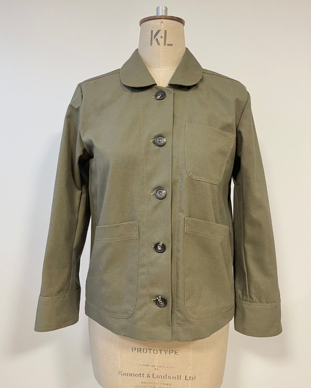 Green hornbeam jacket on a mannequin
