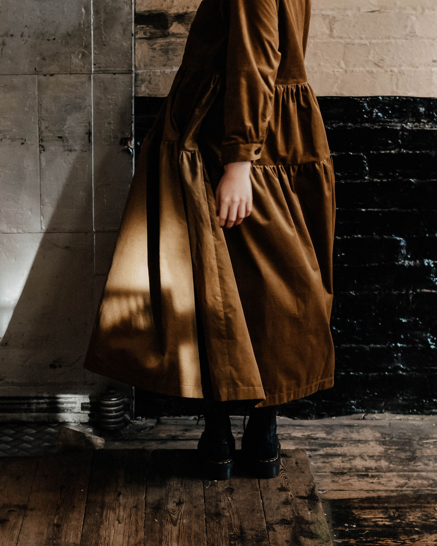 woman in brown tiered dress
