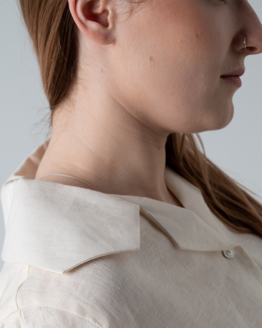 close up of woman's neck showing collar detail.