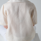 short sleeve linen blouse with revere collar in cream, back view