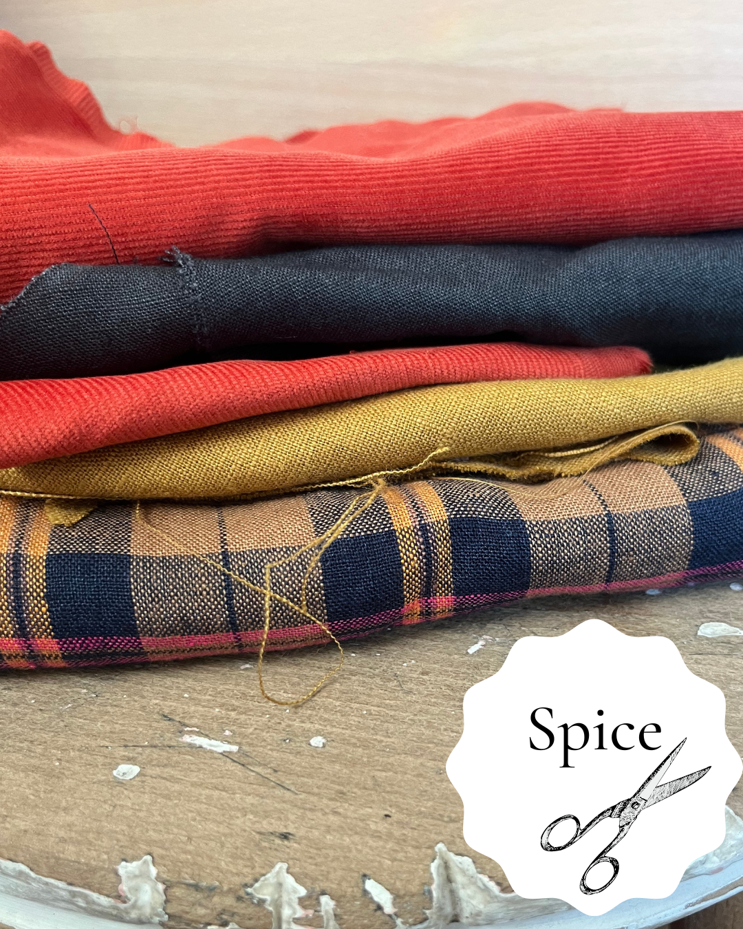 A collection of premium scraps for zero waste sewing projects. Spice colours, orange, gold, brown etc.