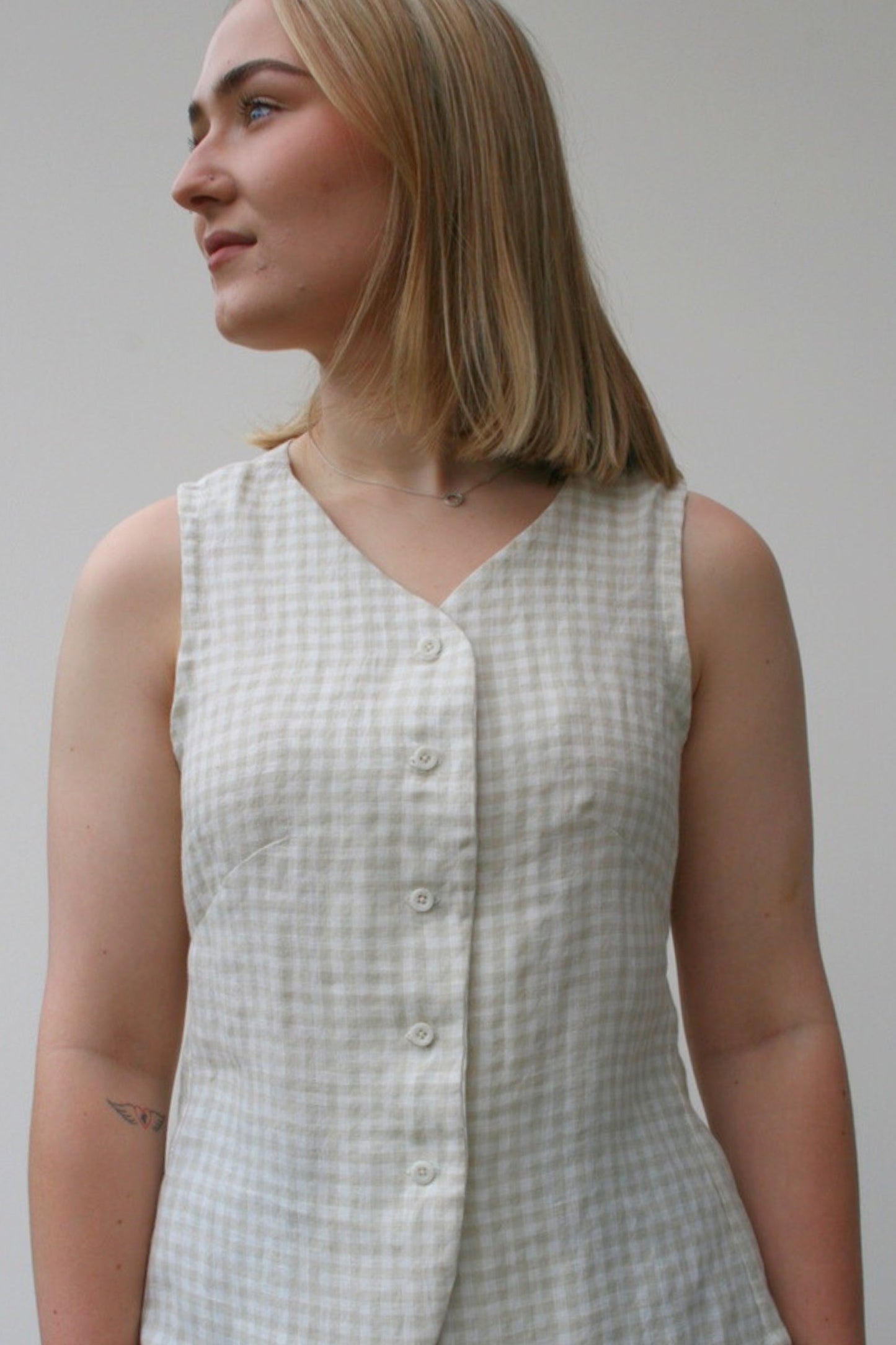 Waistcoat with structured panels and button fastening