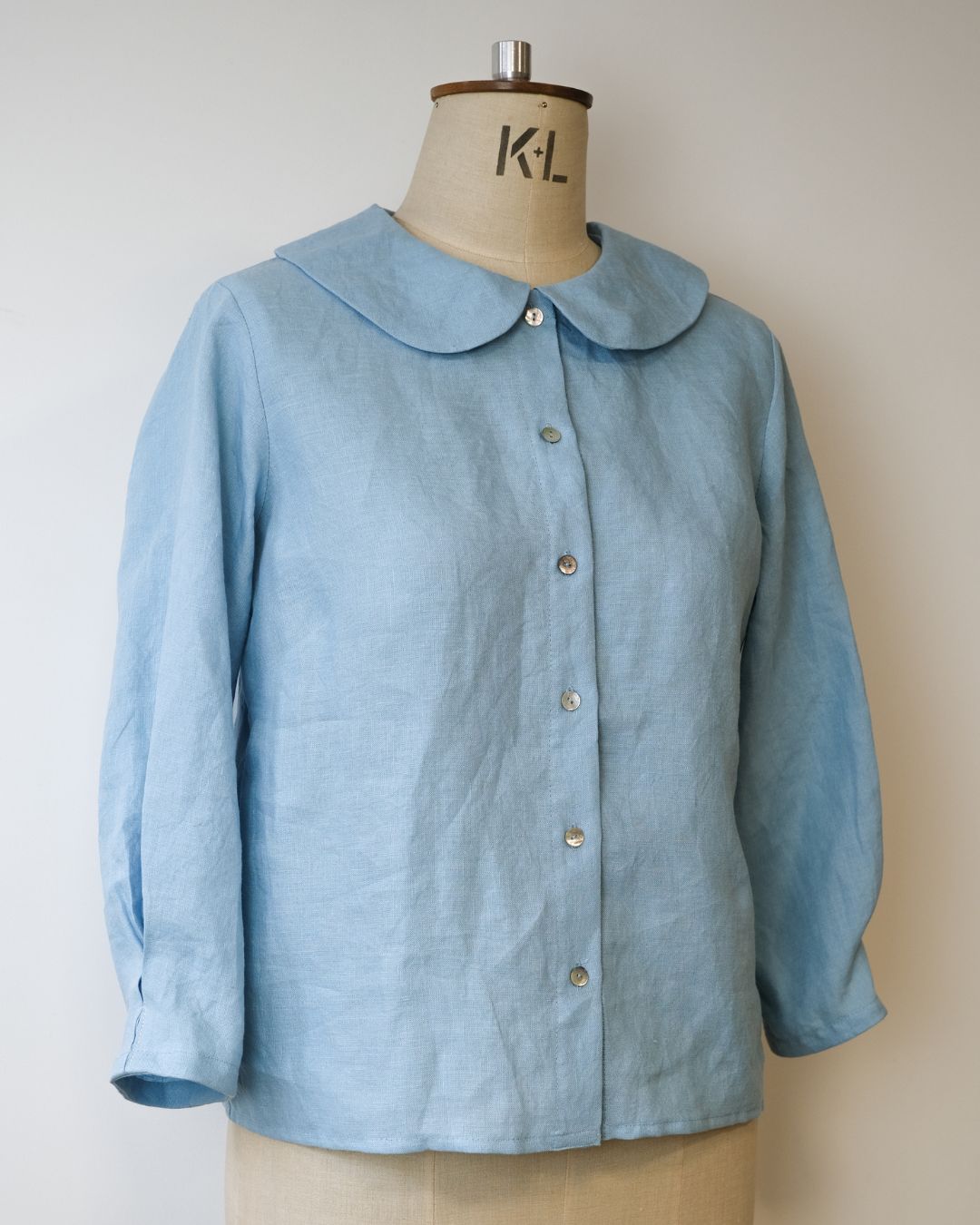 blue linen shirt on dress makers dummy