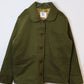 Green jacket against white background