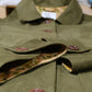 green jacket layed flat