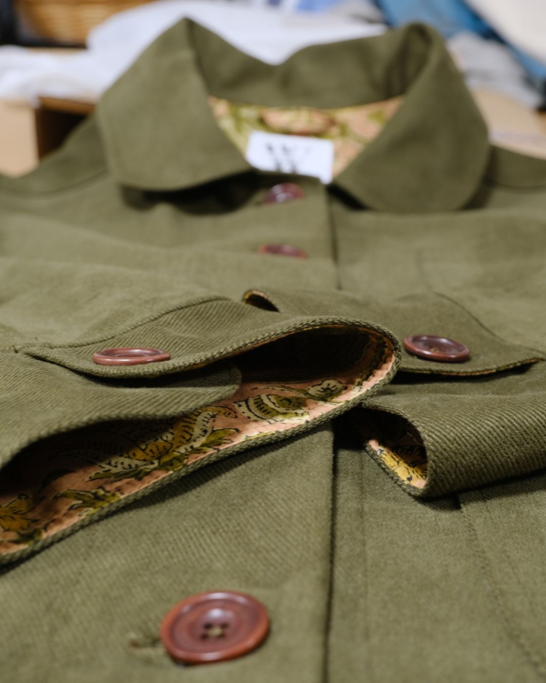 green jacket layed flat