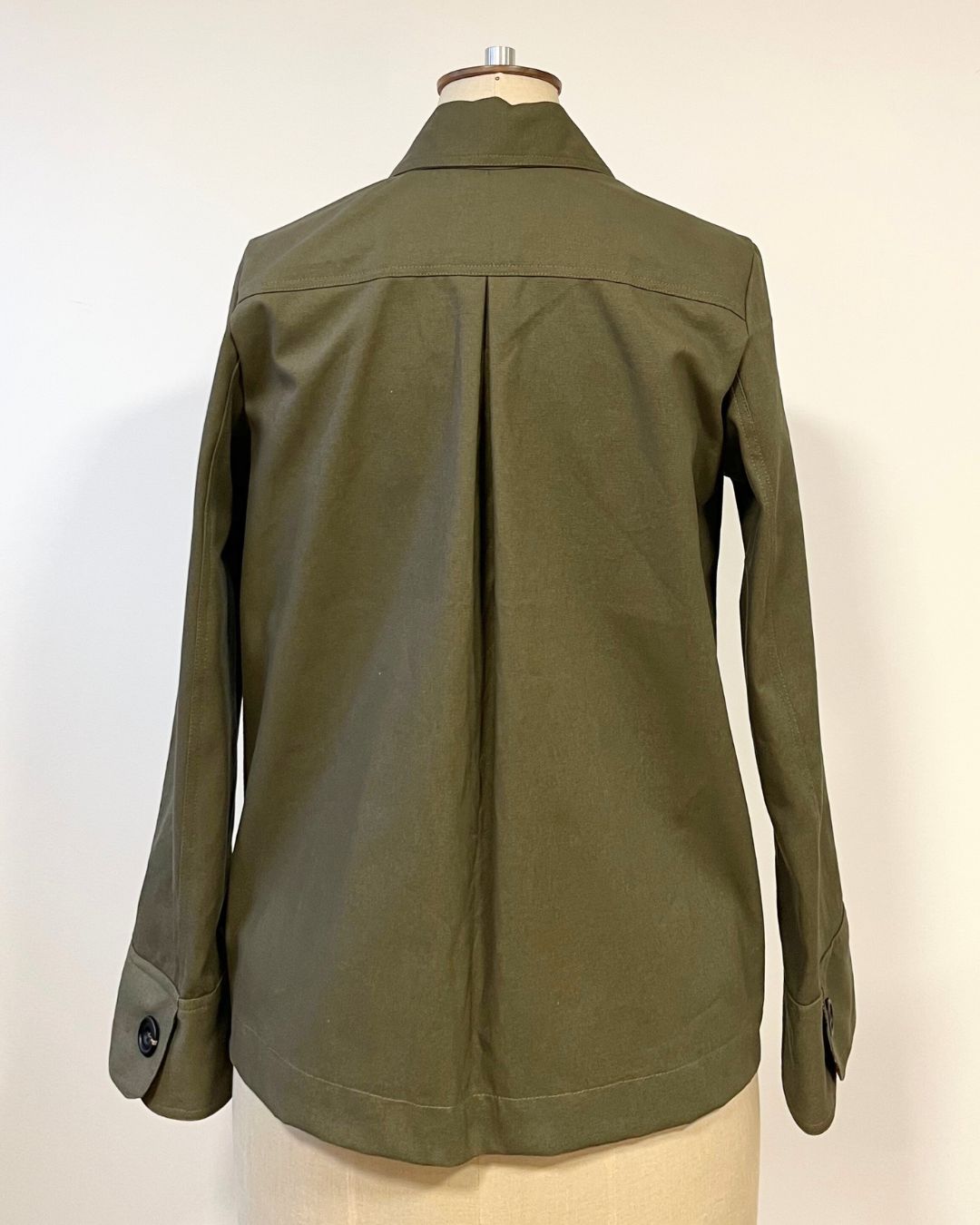 Green hornbeam  jacket on a mannequin 