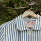 Striped jacket  on a hanger with a blurred natural background