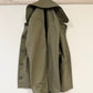 Green jacket with buttons on a white background