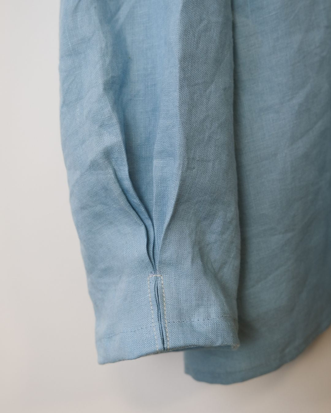 close up sleeve detail of blue  linen shirt 