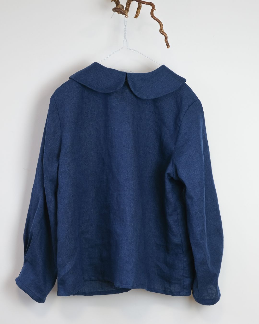 Blue jacket with a collar on a white background