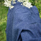 close up image of denim jacket with slubby texture