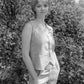 Woman standing outdoors in a natural setting