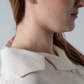 close up  of woman's neck showing collar detail.